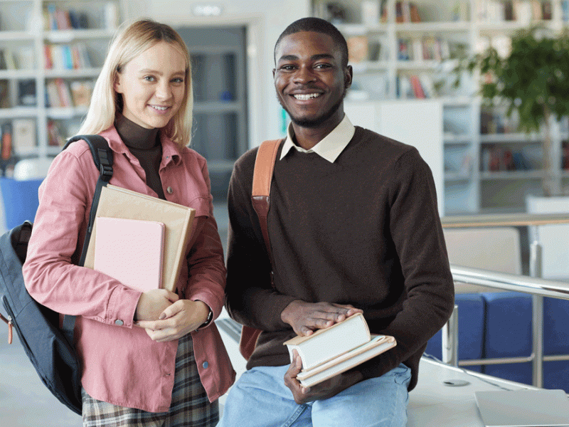 two-students-in-college-library-K53SV6Z